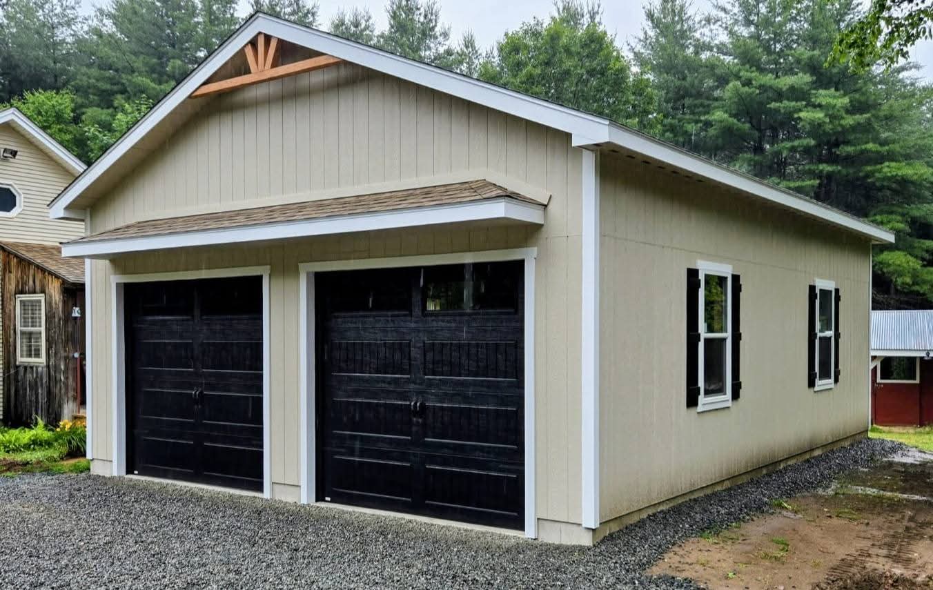 Custom two-car garage with modern 8-foot-wide garage doors built by Hometown Structures