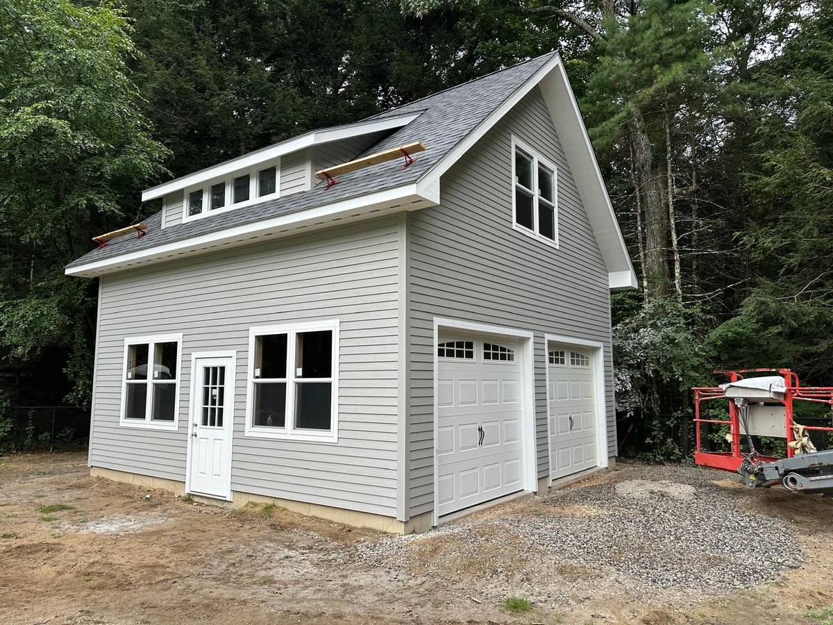 Story-and-a-half garage with dormer windows built by Hometown Structures