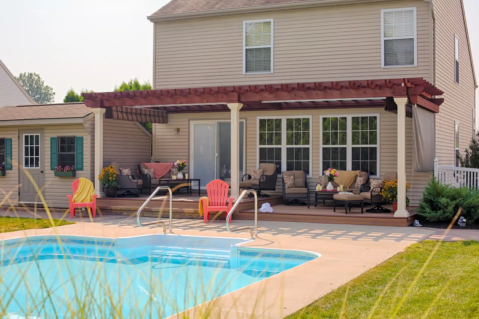 Rustic pergola attached to house