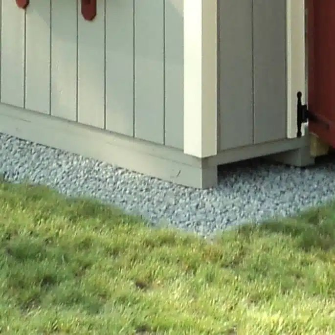 Level stone pad site preparation for a storage shed